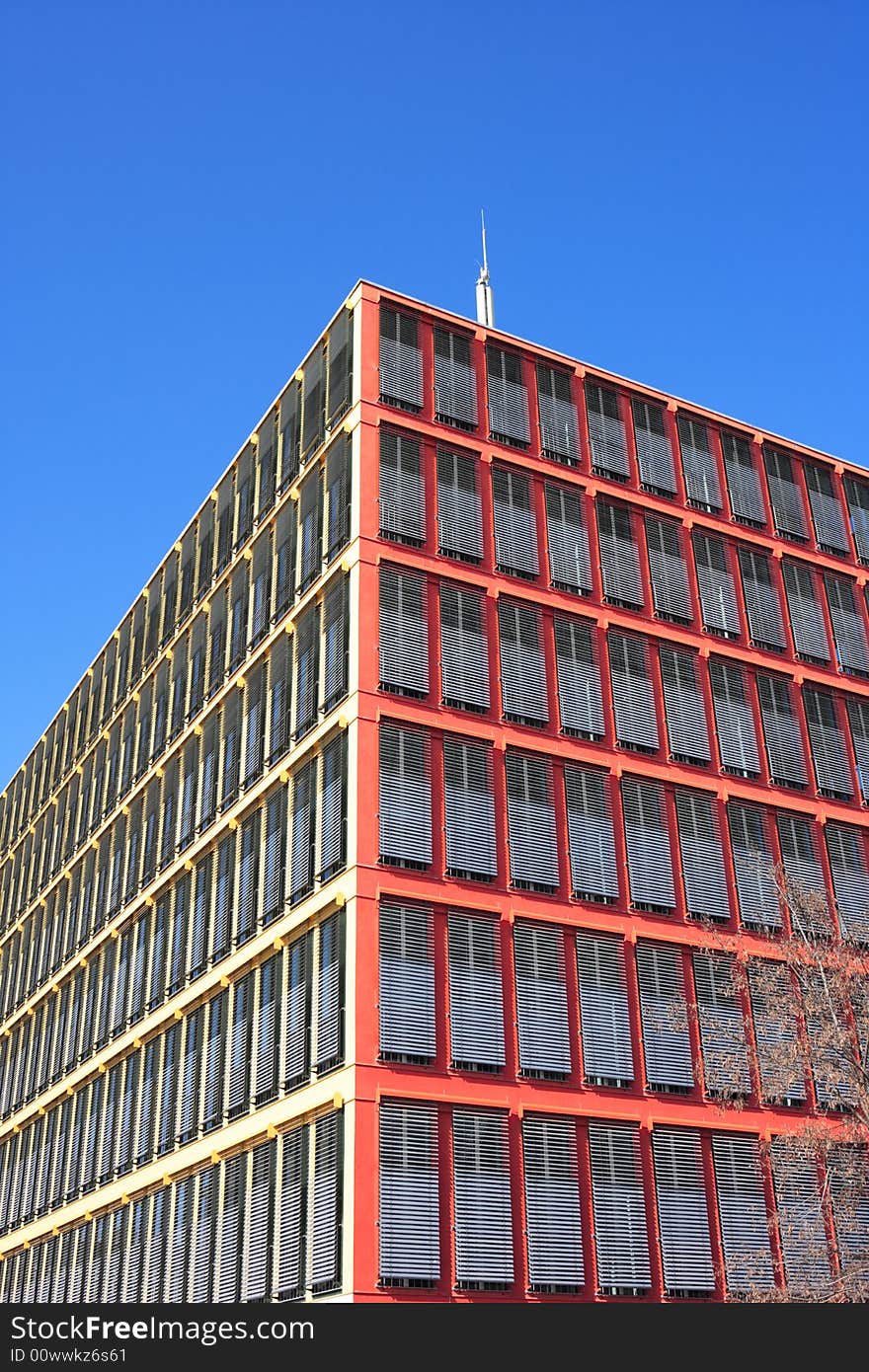 Colorful office building against blue sky