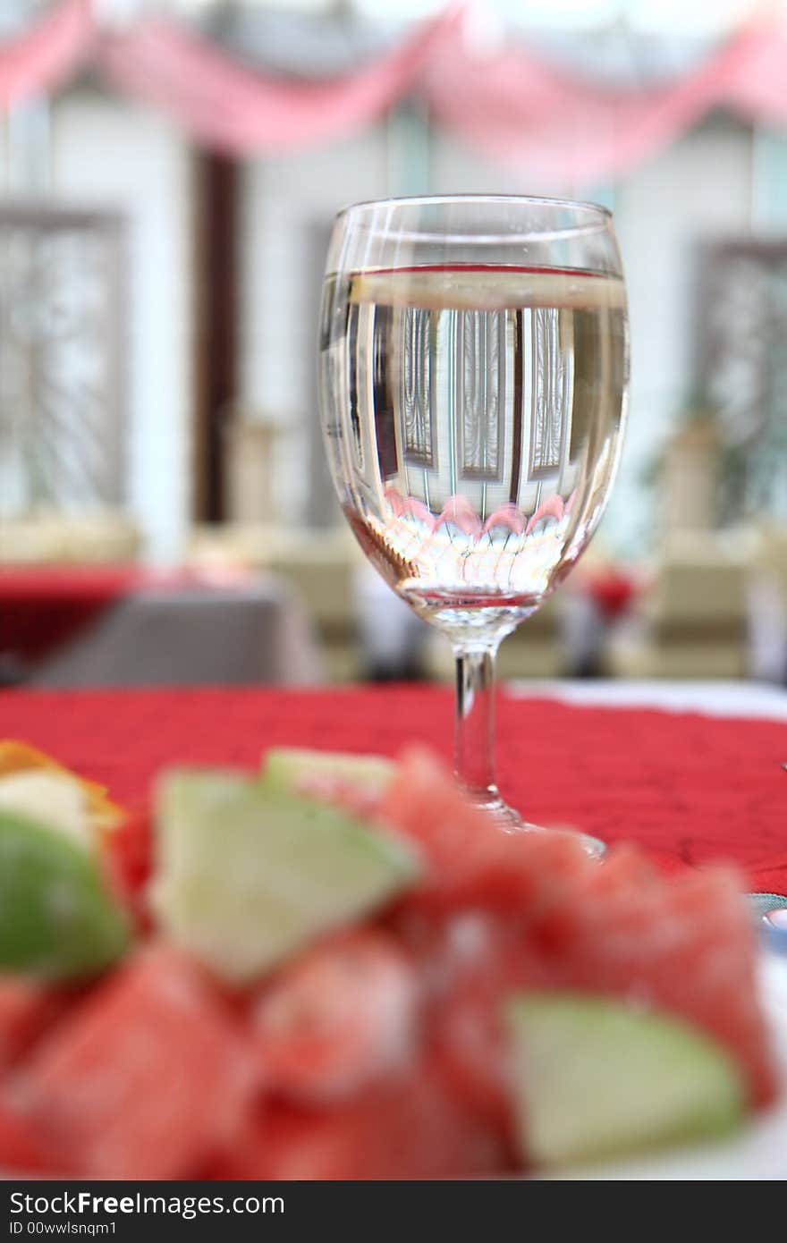 Appetizing salad on a plate with cup of drinking. Close up