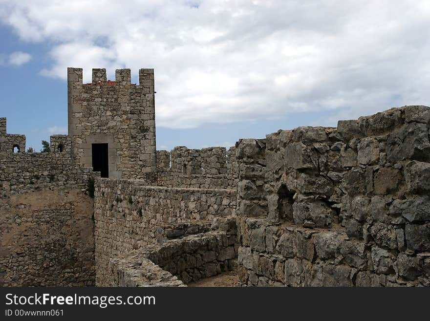 Castle wall perspective, isolated in blue sky background