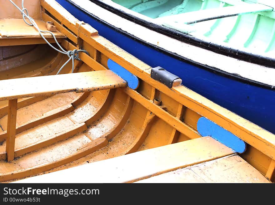 Detail of two boats (yellow and blue) at the dock. Detail of two boats (yellow and blue) at the dock