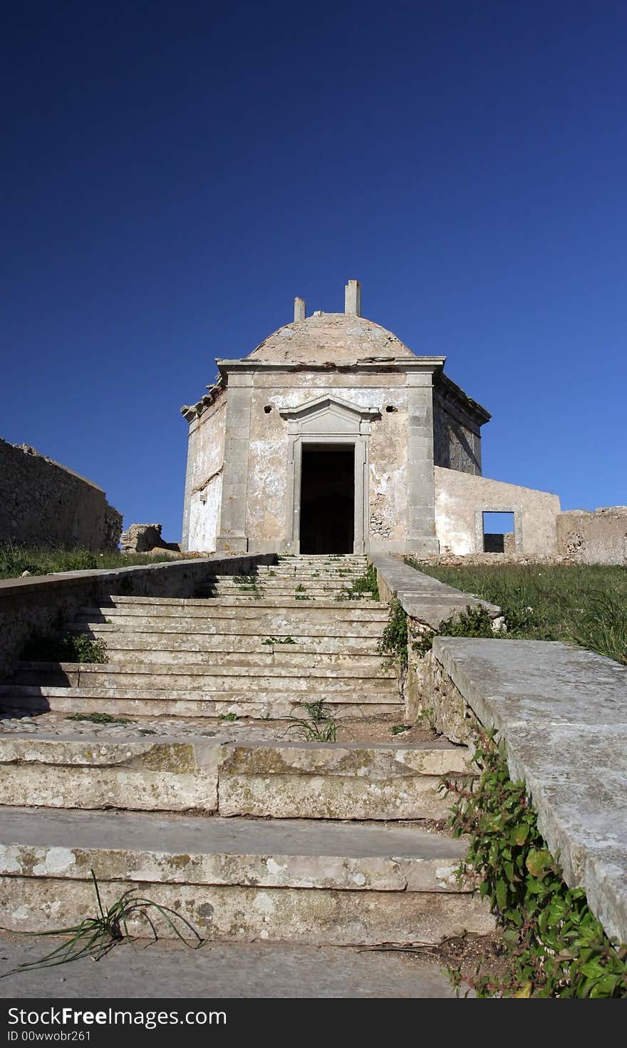 Path to a old church, isolated in blue sky