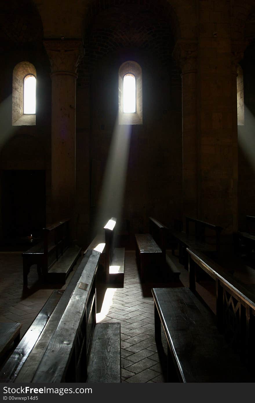 Sun shining through the window of a deserted abbey. Sun shining through the window of a deserted abbey