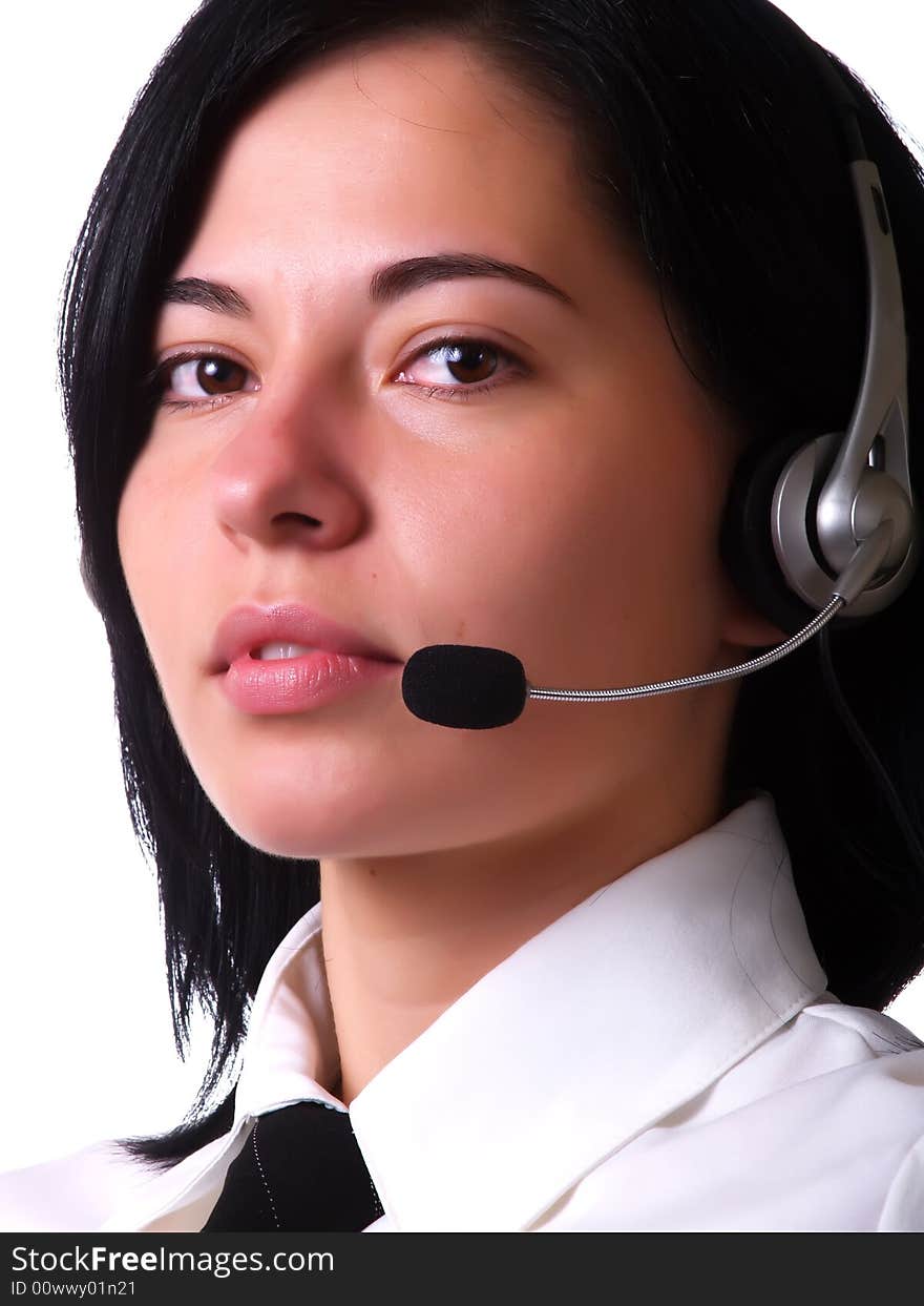 A portrait about a young pretty customer service representative lady with black hair who is smiling, she has a headphone, and she is wearing a white shirt and a black tie. A portrait about a young pretty customer service representative lady with black hair who is smiling, she has a headphone, and she is wearing a white shirt and a black tie