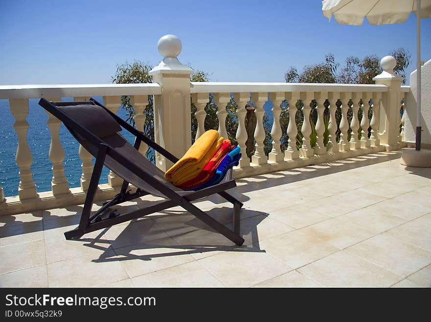 Colorful summer towels on a hotel balcony. Colorful summer towels on a hotel balcony