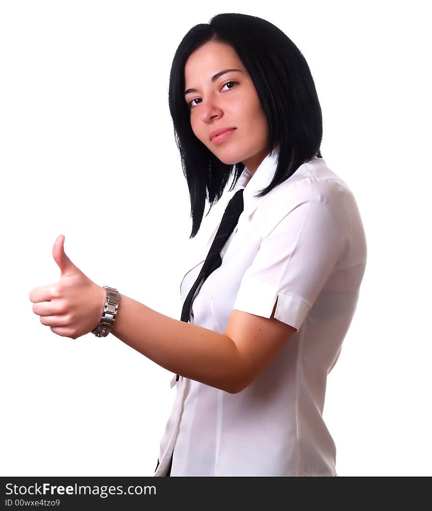 A portrait about a young pretty happy businesswoman with black hair who is giving the thumbs up and she is wearing a white shirt and a black tie. A portrait about a young pretty happy businesswoman with black hair who is giving the thumbs up and she is wearing a white shirt and a black tie