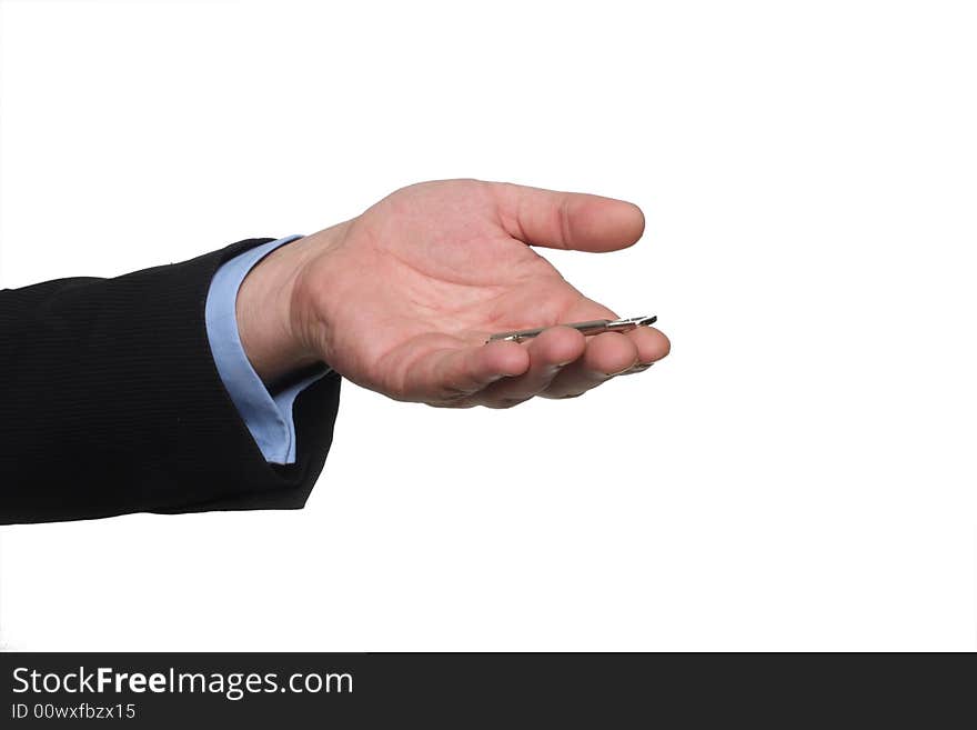 Cropped shot of human hand in black suit holding out house keys. Cropped shot of human hand in black suit holding out house keys