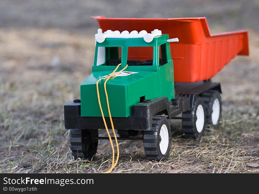 The toy lorry on a grass