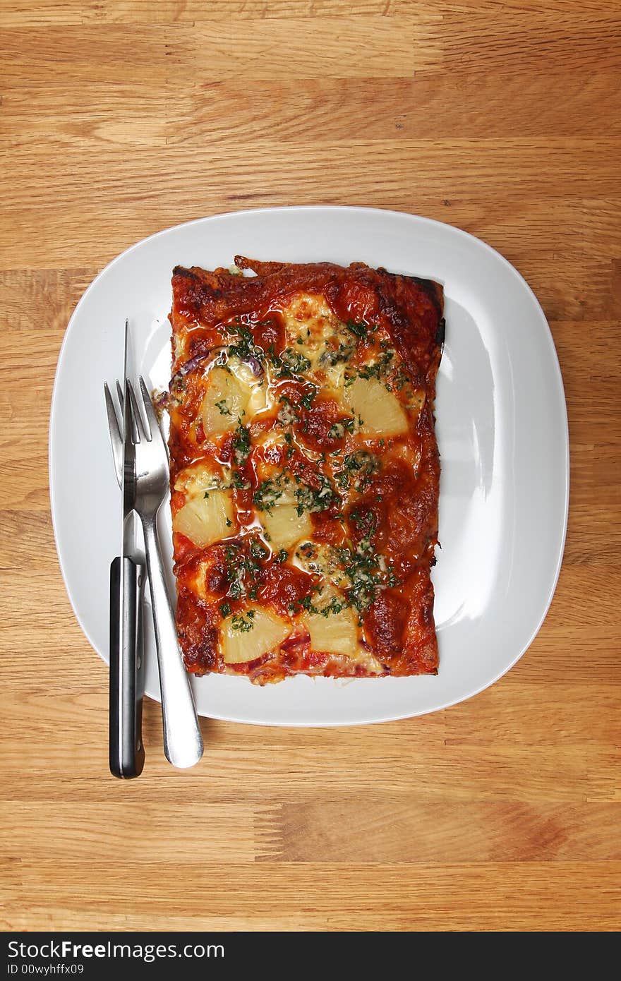 Homemade pizza on a white plate