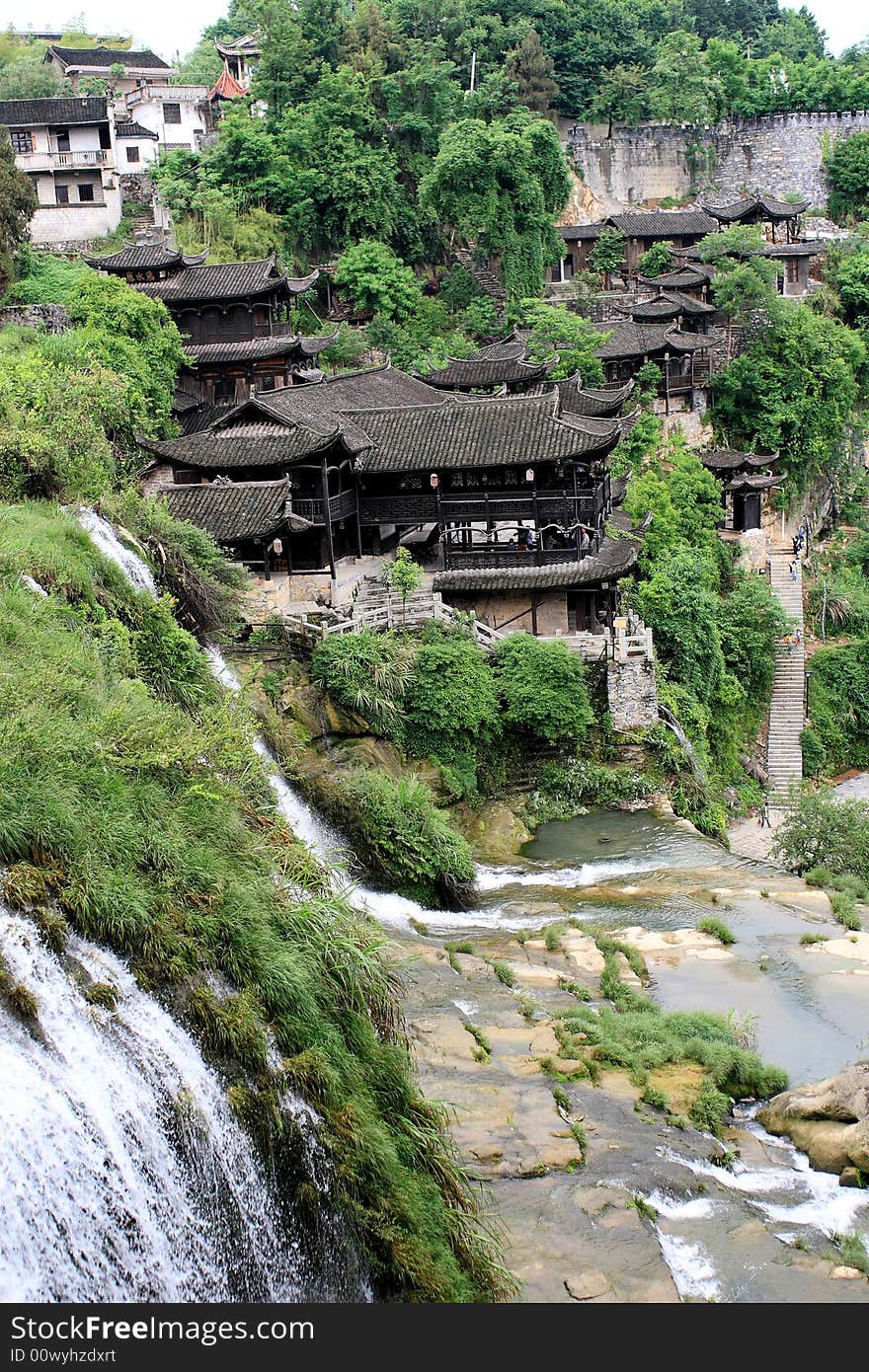 An ancient town beside a beautiful waterfall