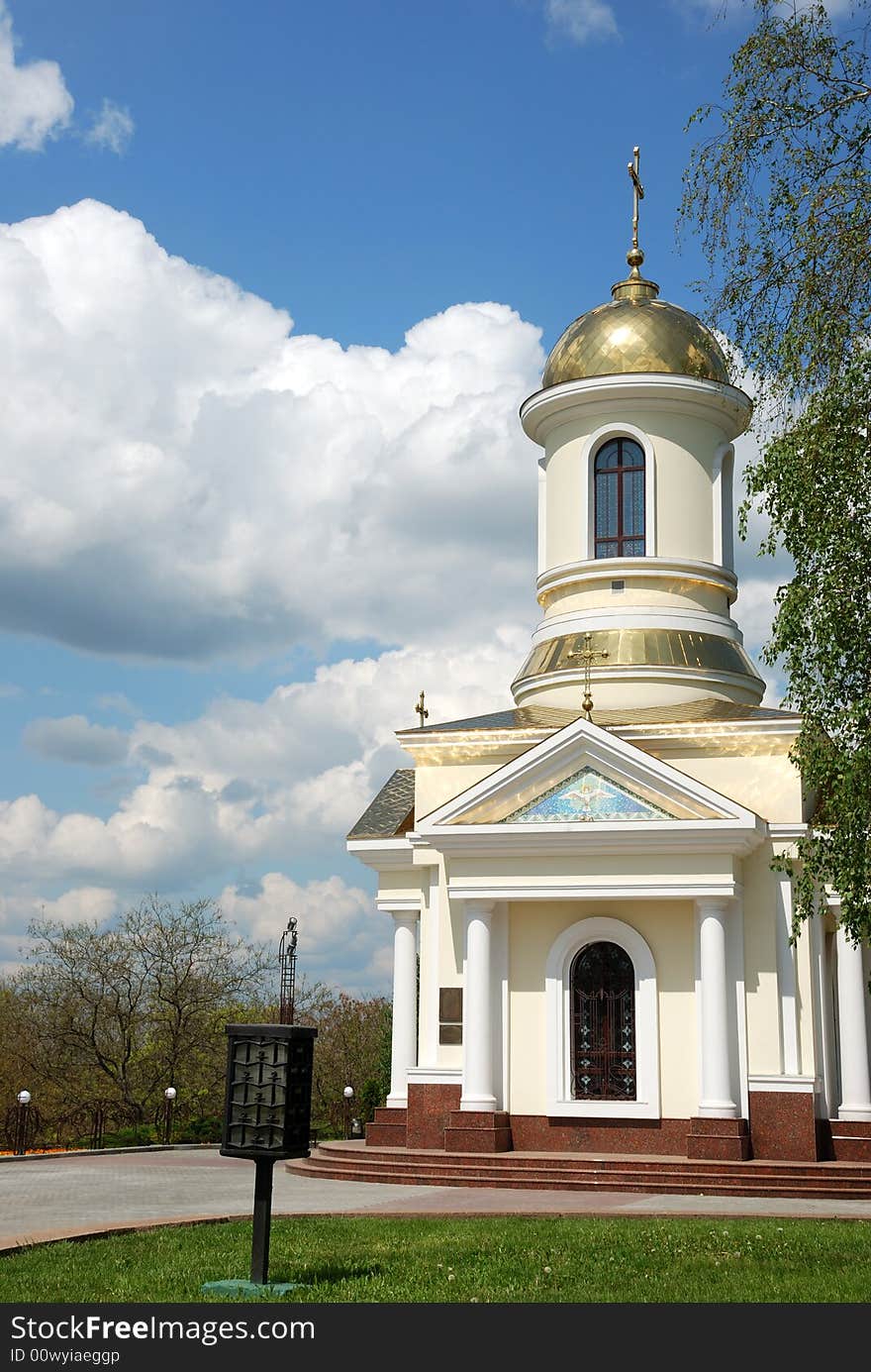 Small church over cloudy sky