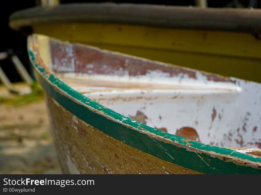 Old rowing boat washed up on shore