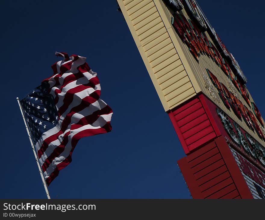 American flag shot by the road in the wind