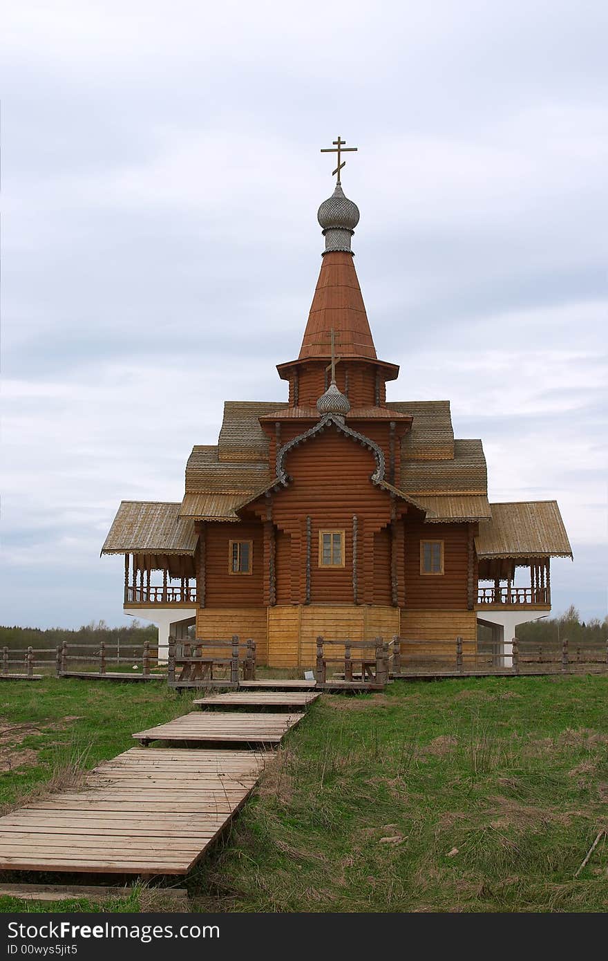 Small orthodox church from wood over blue sky. Small orthodox church from wood over blue sky