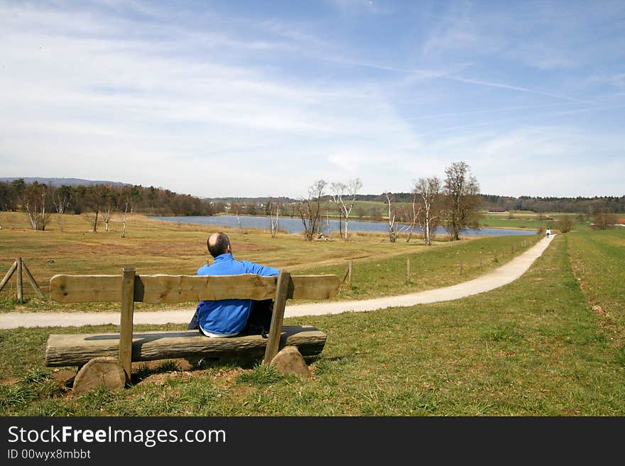 Wooden bench in rural landscape. Wooden bench in rural landscape