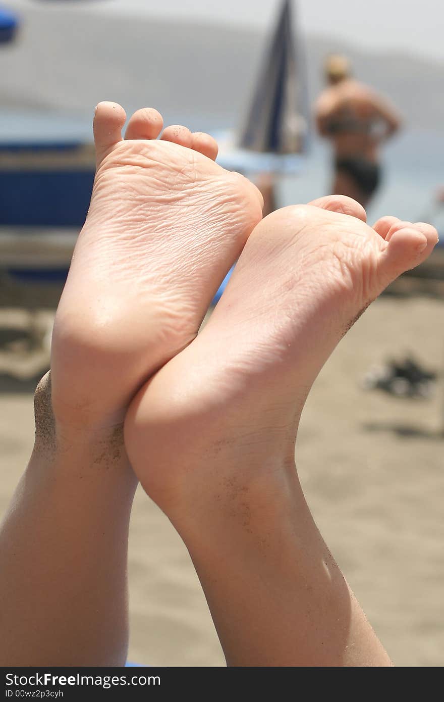 Children's heels, photo it is made on a beach on island Tenerife. Children's heels, photo it is made on a beach on island Tenerife