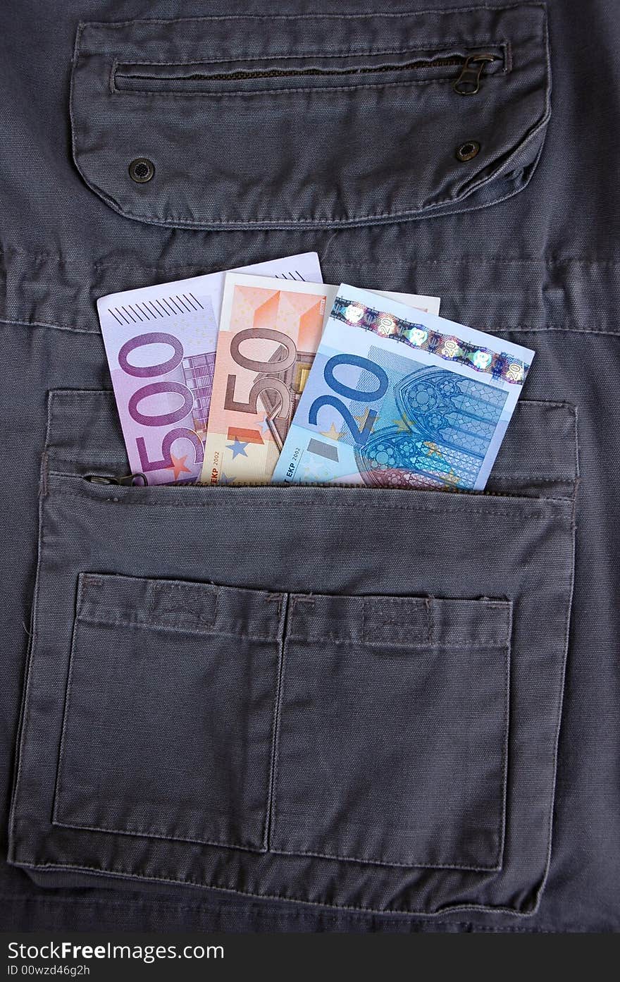 Euro in the pocket of a casual garment.  Photographed in a studio.