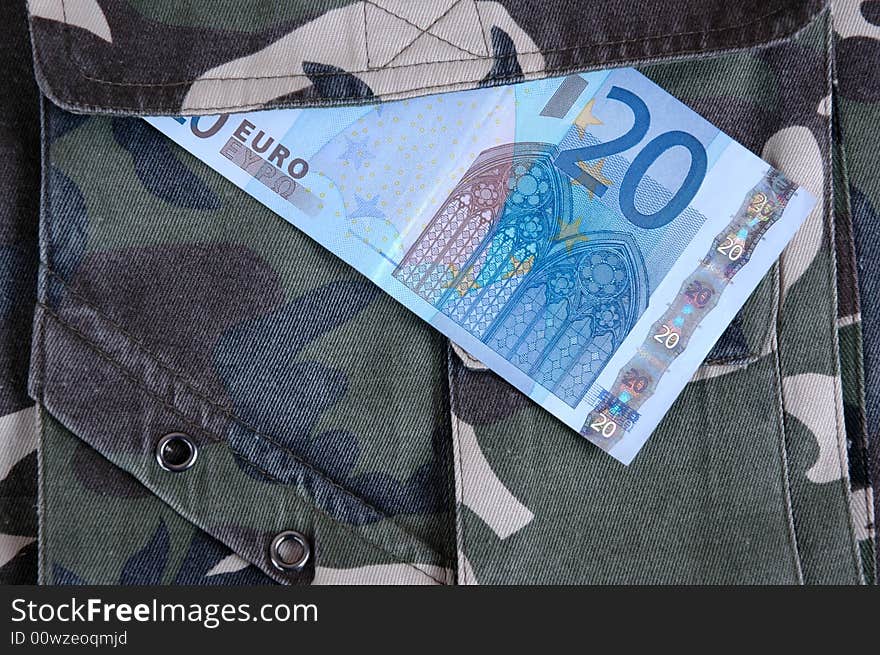 Euro in the pocket of a casual garment. Photographed in a studio.