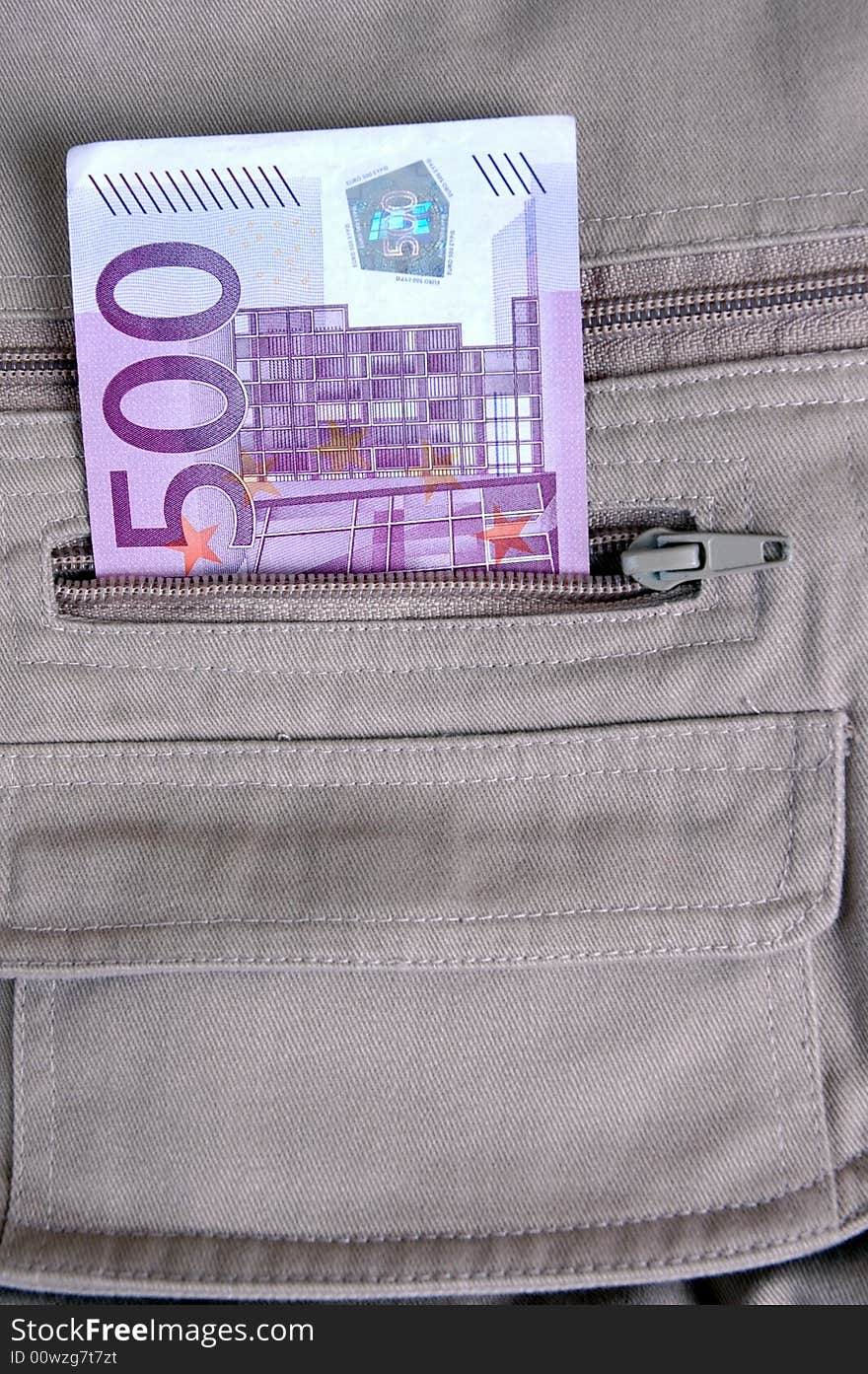 Euro in the pocket of a casual garment. Photographed in a studio.