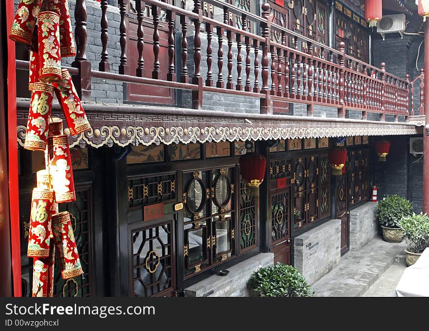 Ancient floor with strong distinct Chinese characteristics.

Chinese on the firecracker is the good fortune.Chinese on all doors has good luck.