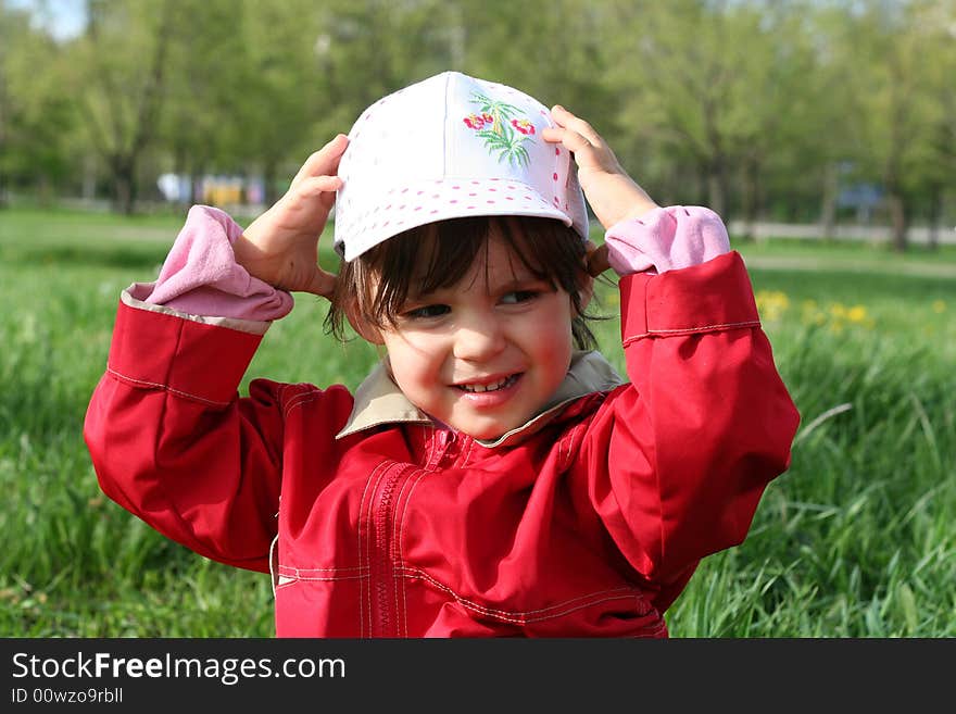 Little girl happy smiling in spring park