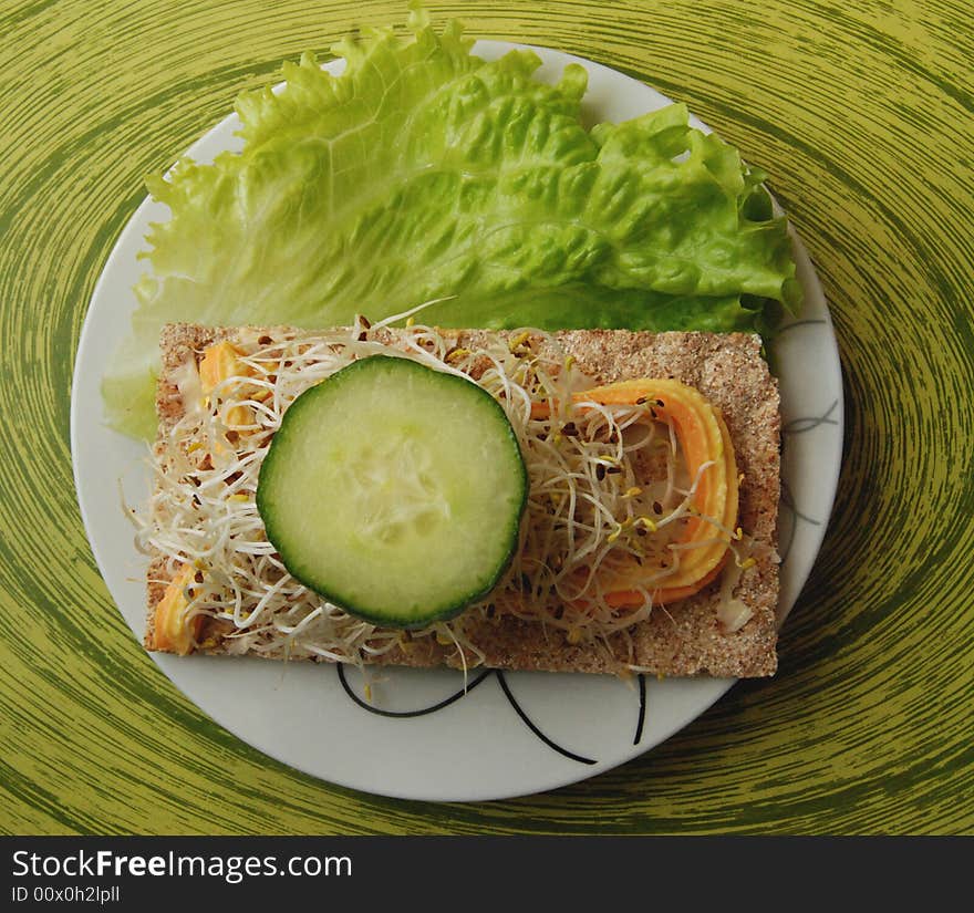 Cucumber, calad, bread in breakfast. Cucumber, calad, bread in breakfast