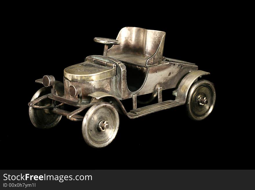 The tiny car. Jewel from bronze, copper, silver. The tiny car. Jewel from bronze, copper, silver.