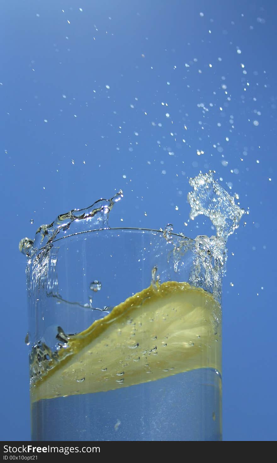 Lemon in a glass of water on sky. Lemon in a glass of water on sky