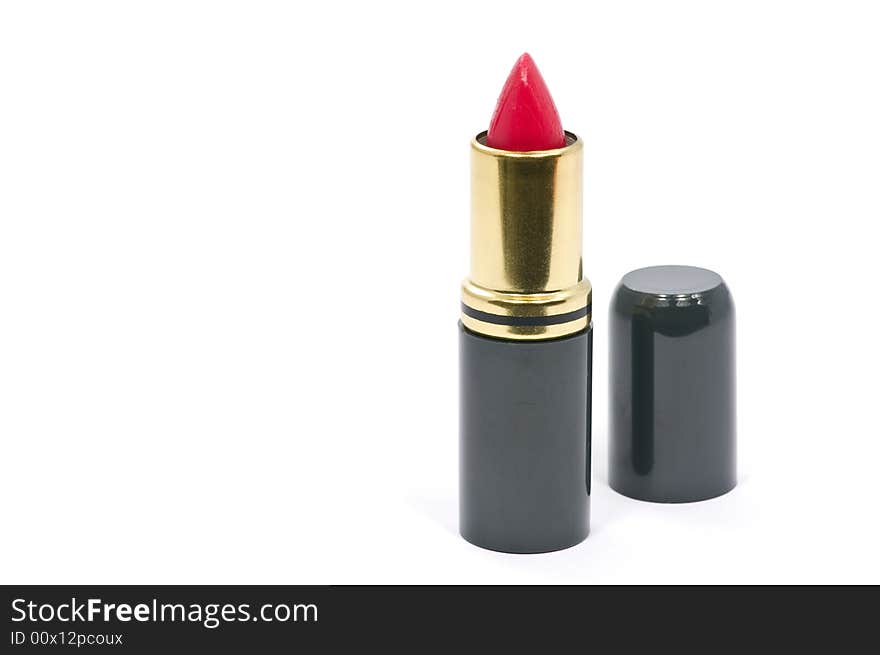 Single red lipstick on white background