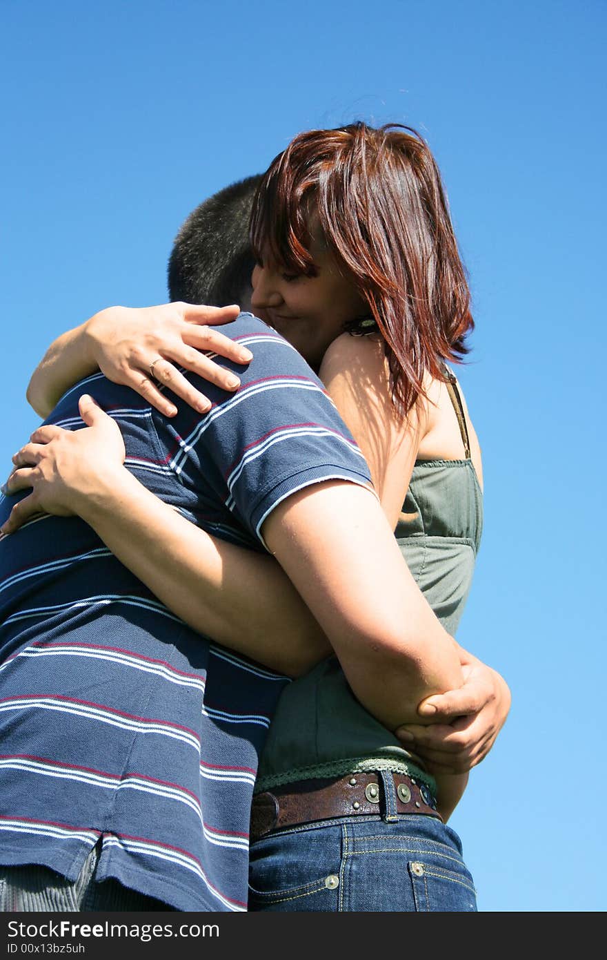 Young couple on the sky background. Young couple on the sky background