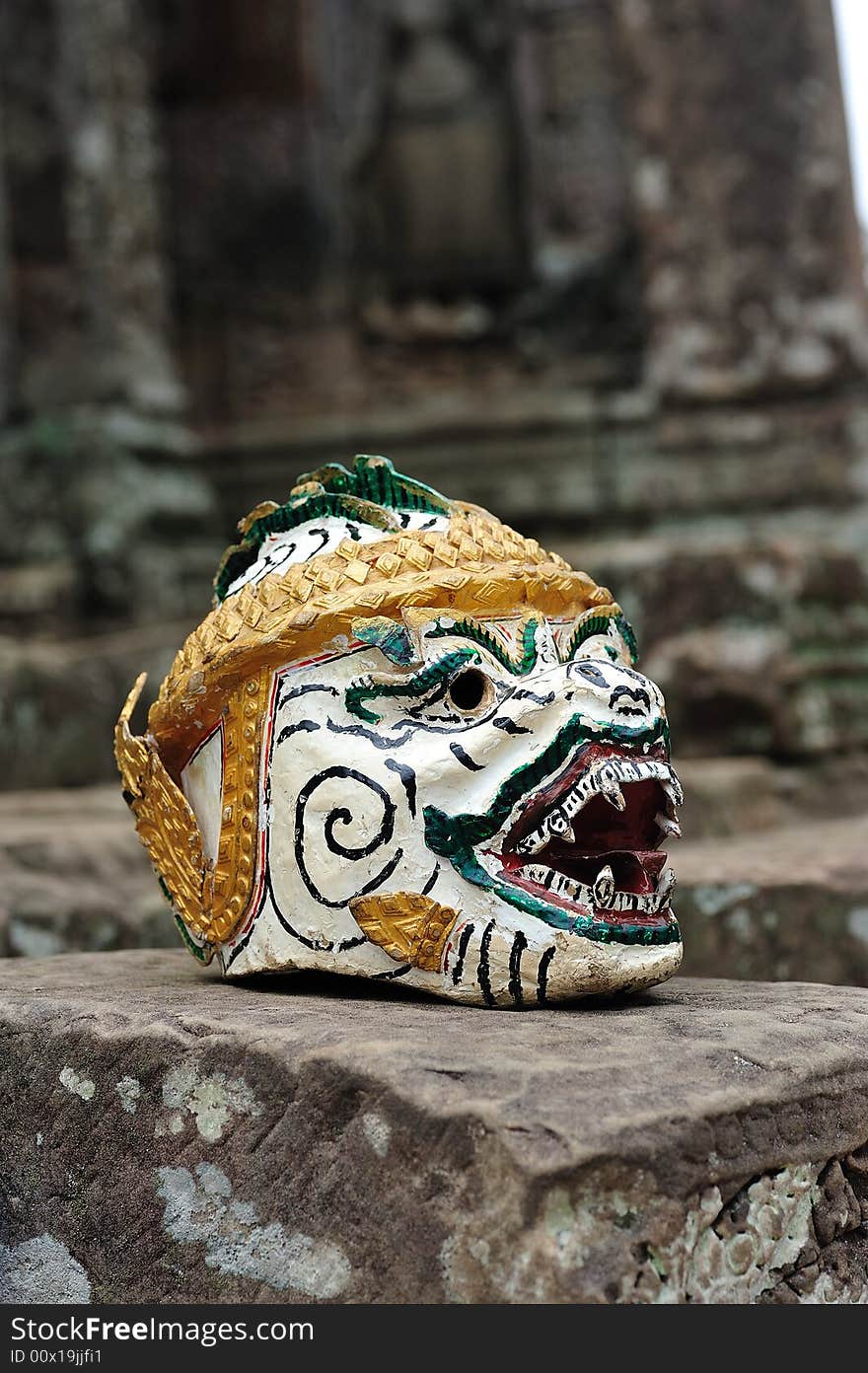 The bayon construction started probably arround 1200 AD during the reign of Jayavarman VII to Jayavarman VIII. Art historians considered that this temple is one of the most enigmatic religious construction in the world.  here a  khon mask  on the top terrace of the temple. The bayon construction started probably arround 1200 AD during the reign of Jayavarman VII to Jayavarman VIII. Art historians considered that this temple is one of the most enigmatic religious construction in the world.  here a  khon mask  on the top terrace of the temple