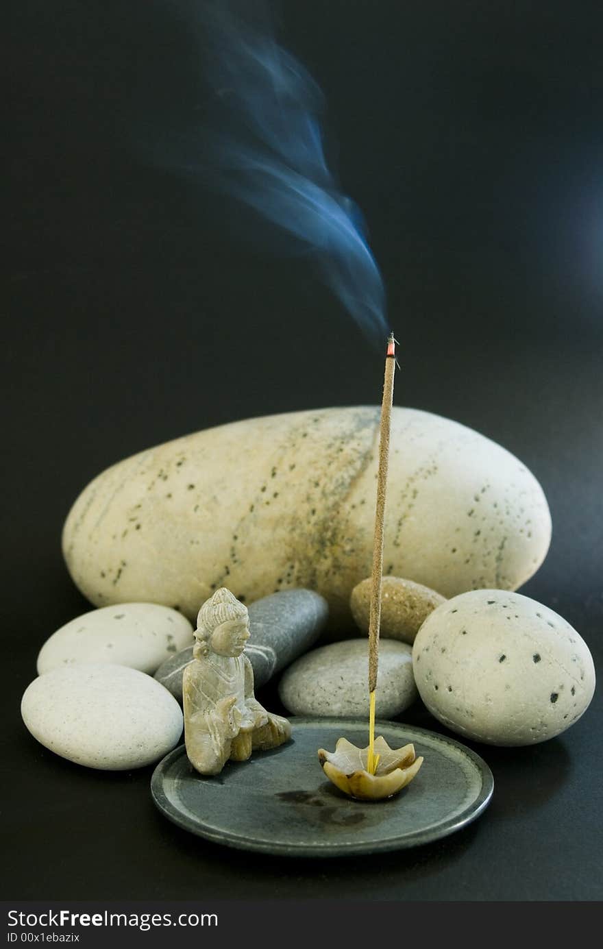 Incense stick and stones for a quiet meditation. Incense stick and stones for a quiet meditation