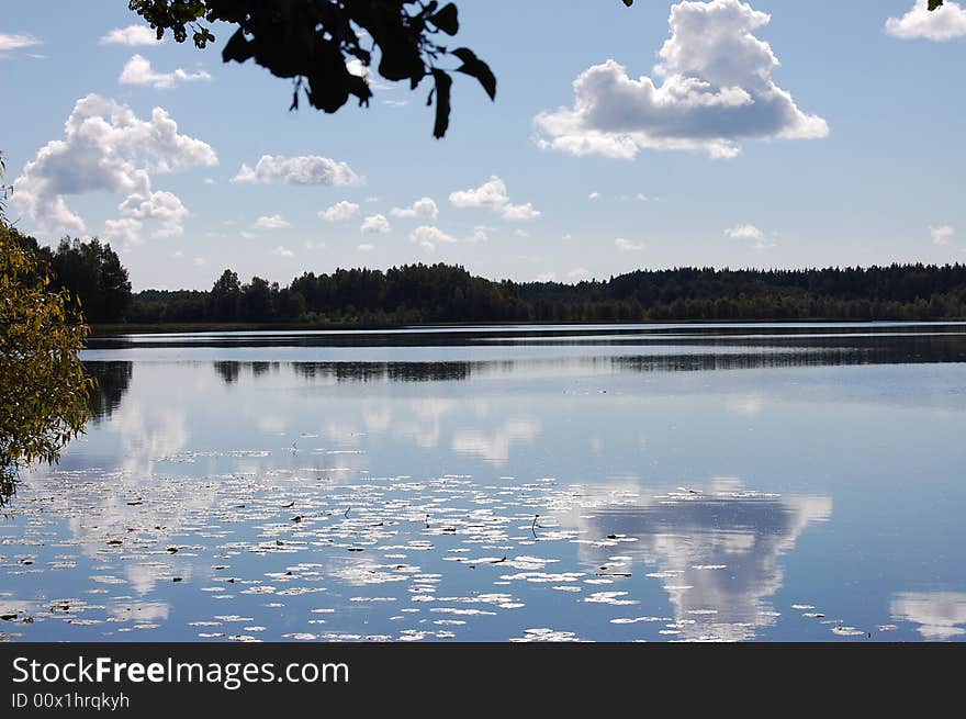 Lake under sky and clouds. Lake under sky and clouds