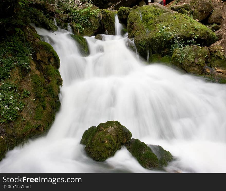 Waterfall among the stones, blurred motion