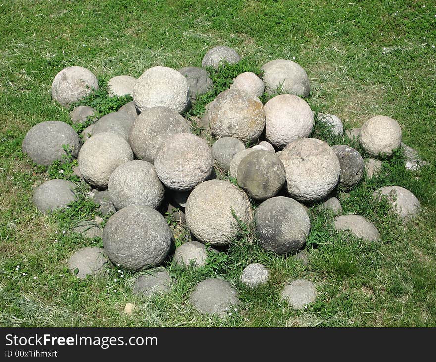 Ancient cannon balls on the grass