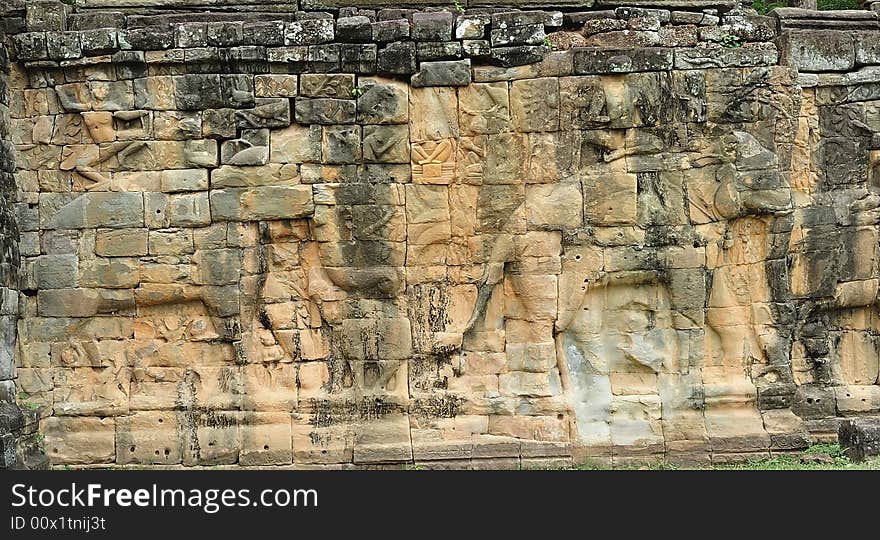 The elephant terrace in the style of bayon date from the 12th century with additions in  late 13th century during the reigns of Jayavarman VII and Jayavarman VIII ; this terrace looking out to the royal square is supported by  300 meters of walls of  foundation; these walls  are carved with elephants, garudas and lion headed figures. The elephant terrace in the style of bayon date from the 12th century with additions in  late 13th century during the reigns of Jayavarman VII and Jayavarman VIII ; this terrace looking out to the royal square is supported by  300 meters of walls of  foundation; these walls  are carved with elephants, garudas and lion headed figures