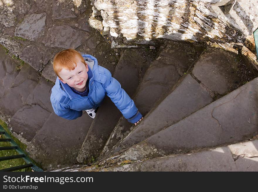 Boy on spiral stairs