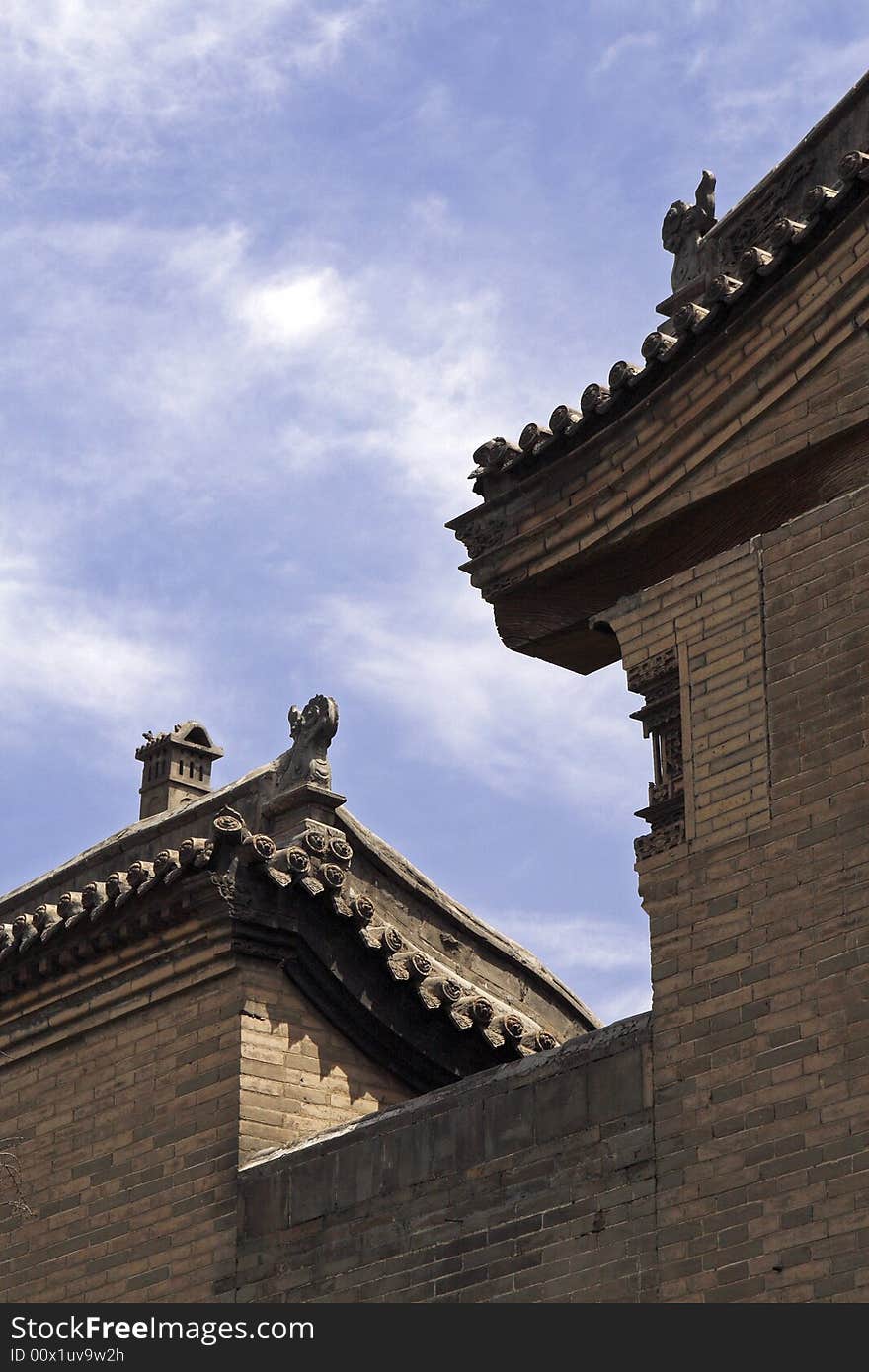 The high wall and old residence. Exquisite roof is ornamental. This ancient residence has already had a history of several hundred years. The high wall and old residence. Exquisite roof is ornamental. This ancient residence has already had a history of several hundred years.