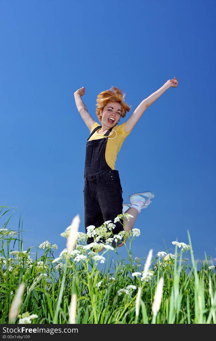 Happy jumping woman on nature. Happy jumping woman on nature