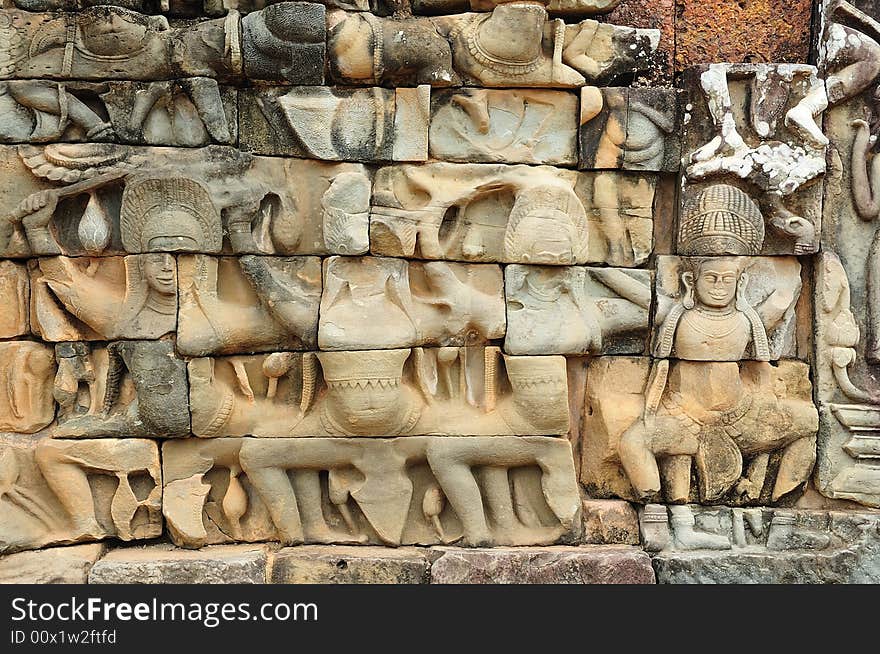 The leper king terrace in the style of bayon date from the 12th century with additions in late 13th century during the reigns of Jayavarman VII and Jayavarman VIII ; this terrace looking out to the royal square is supported by 300 meters of walls of foundation; these walls are carved with elephants, garudas; lion headed figures; nagas and deities. The leper king terrace in the style of bayon date from the 12th century with additions in late 13th century during the reigns of Jayavarman VII and Jayavarman VIII ; this terrace looking out to the royal square is supported by 300 meters of walls of foundation; these walls are carved with elephants, garudas; lion headed figures; nagas and deities