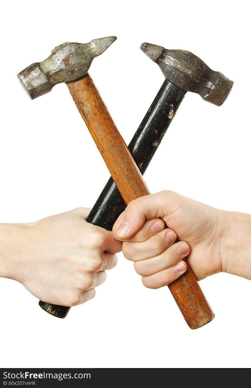 Hands crossing hammers isolated over white background