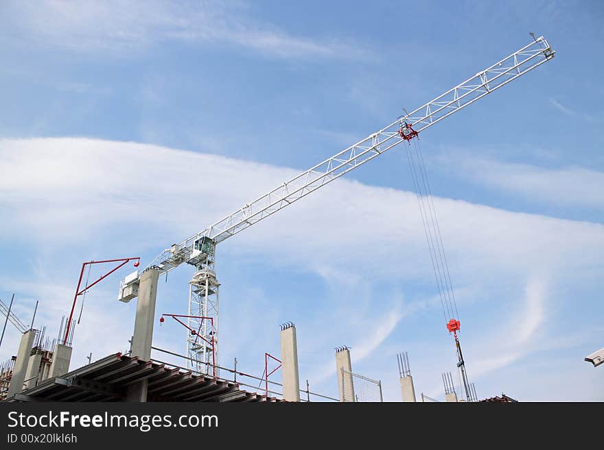 Construction crane against a blue sky. Construction crane against a blue sky