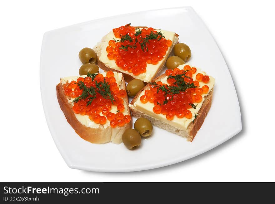 Sandwiches with red caviar on a white plate