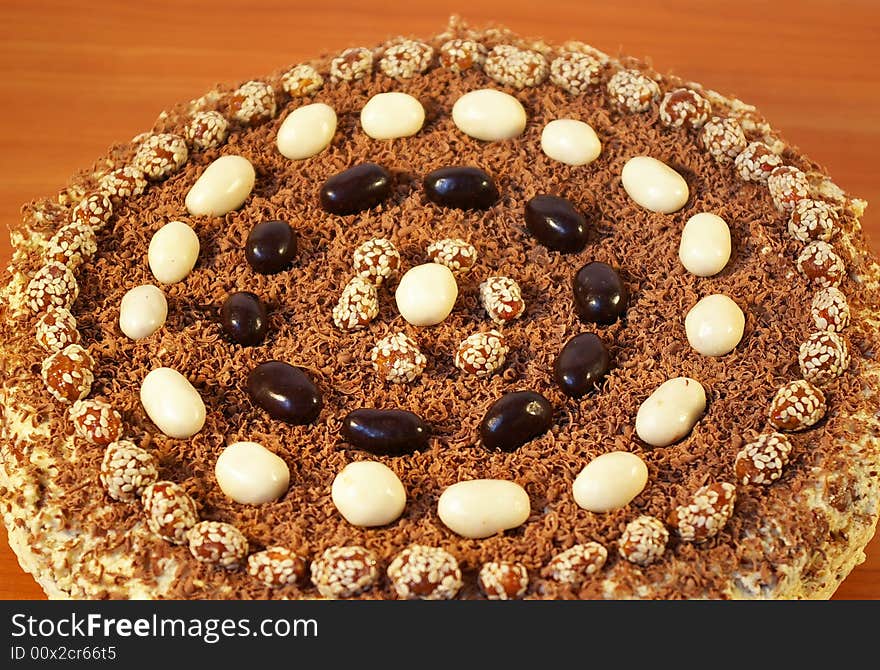 The celebratory ornate chocolate cake on a table