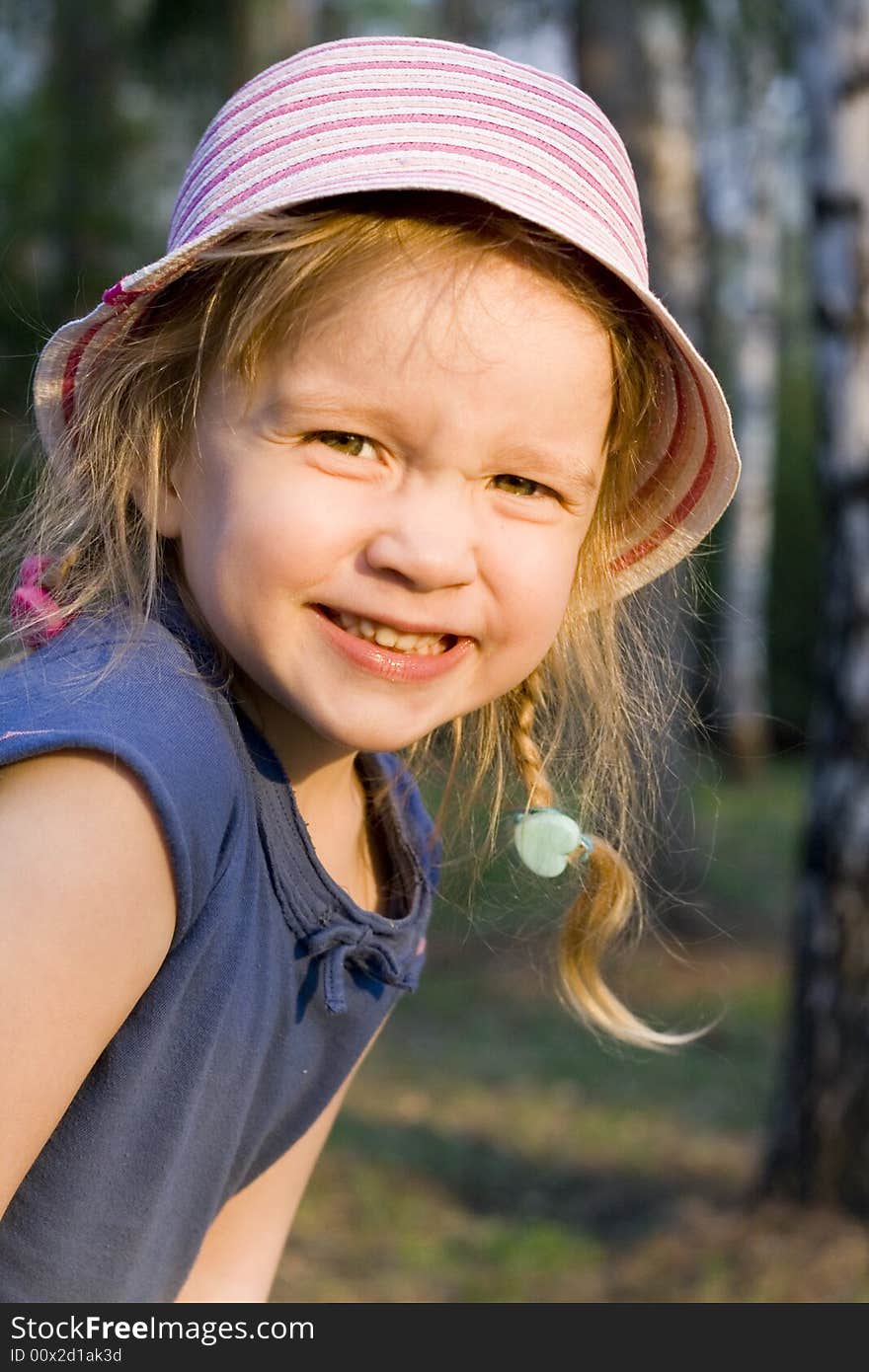 Portrait of a little girl playing in a park with happy sunny smile. Portrait of a little girl playing in a park with happy sunny smile