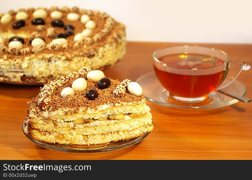 Cup of tea and cake isolated on white background. Cup of tea and cake isolated on white background