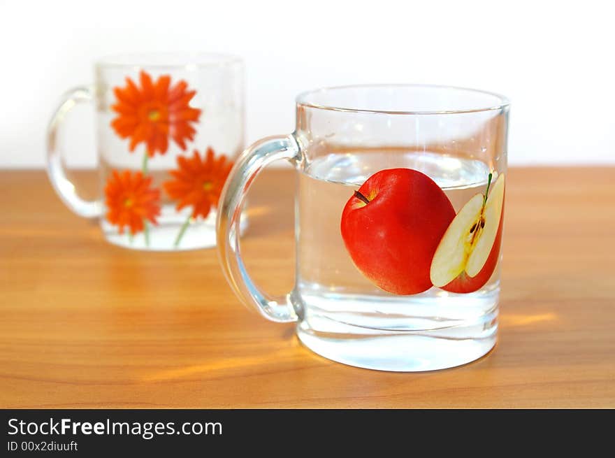 Two transparent cups of water on a table