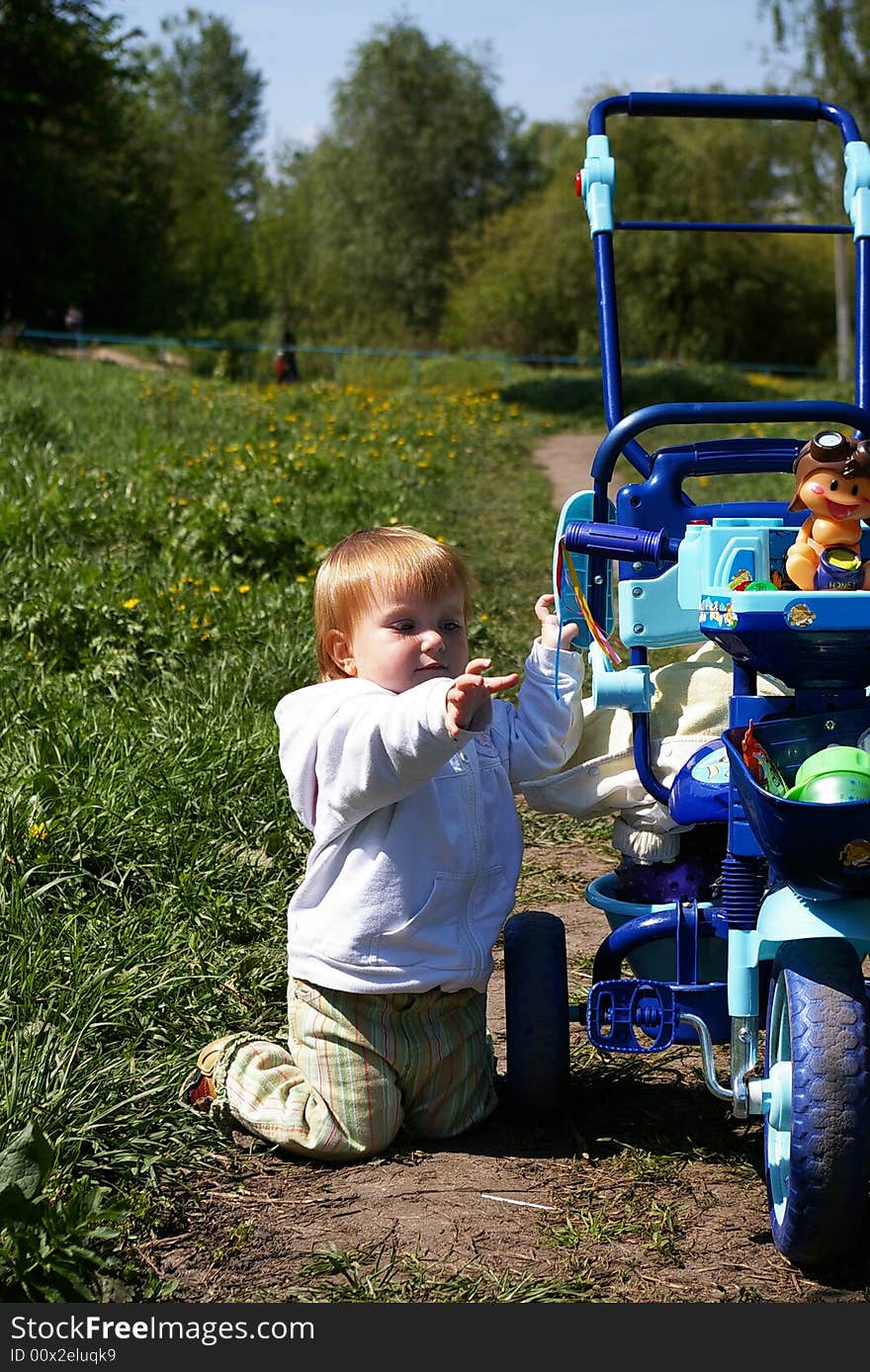 Girl and tricycle