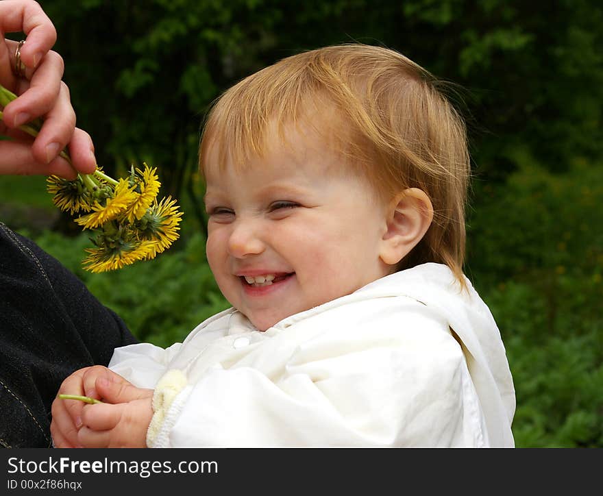 Little Girl Smells Dandelions