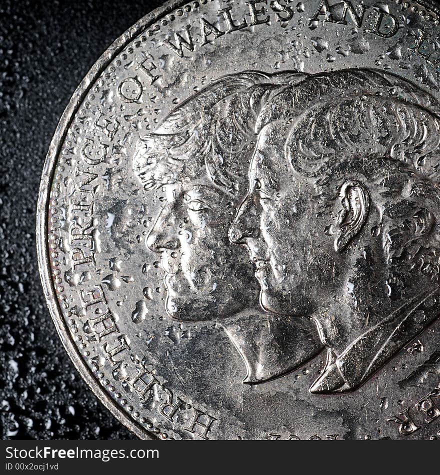 A view with a coins on a wet black background