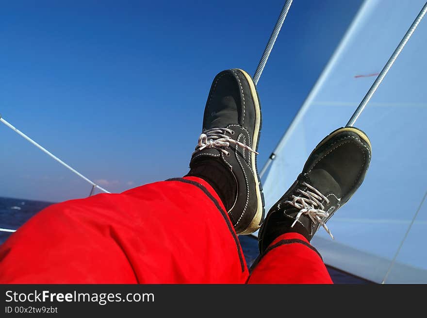 Finding comfortable position at sailing - legs resting. Finding comfortable position at sailing - legs resting